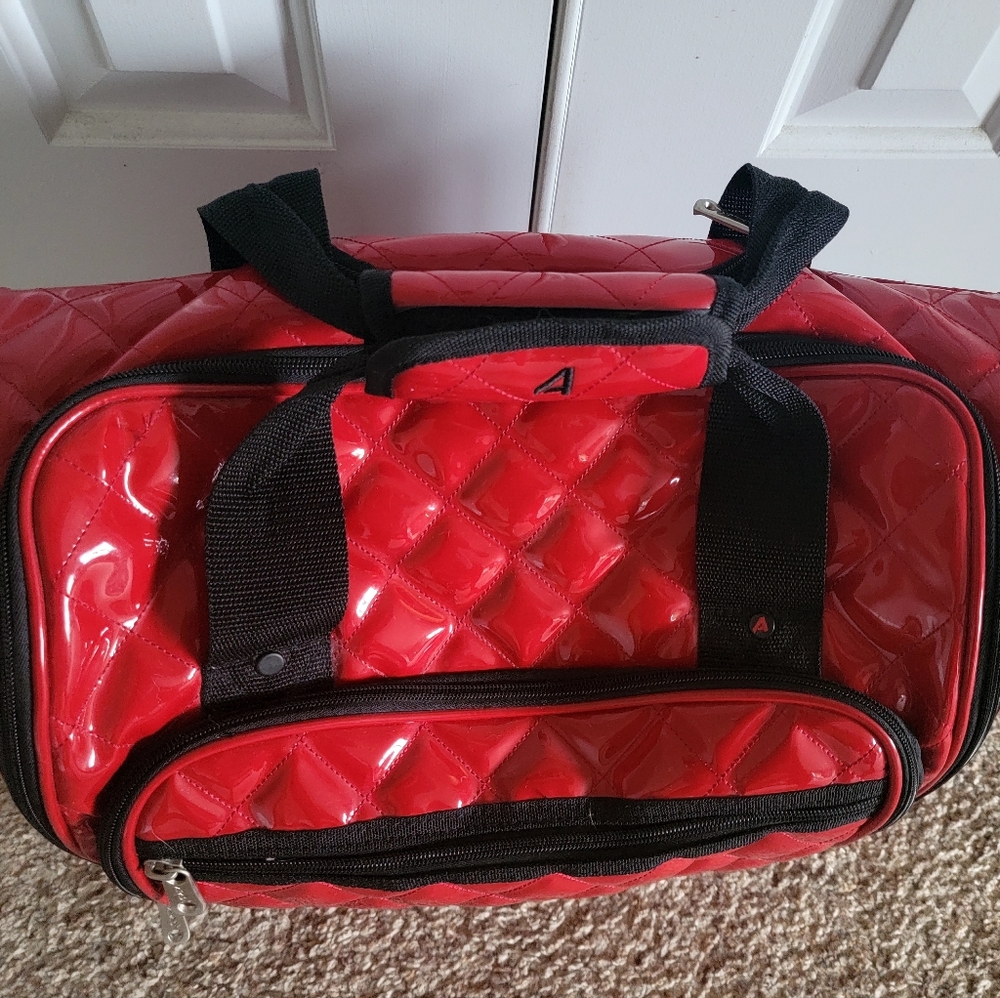 Travel computer or small duffle bag with wheels and extended handle for travel